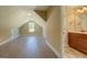 Spacious bonus room with wood flooring, angled ceiling and natural light at 70 Country Meadows Ln, Covington, GA 30014