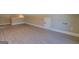 The bonus room has beautiful wood-look floors, white trim and access doors at 70 Country Meadows Ln, Covington, GA 30014