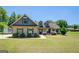 Beautiful single-Gathering home featuring a large, well-maintained lawn and lovely shrubbery at 70 Country Meadows Ln, Covington, GA 30014