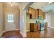 Cozy kitchen with wood cabinets and stainless appliances, adjacent to exterior door at 70 Country Meadows Ln, Covington, GA 30014