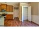 Bright kitchen with pantry, featuring dark countertops and light tile backsplash at 70 Country Meadows Ln, Covington, GA 30014