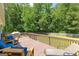Relax in this outdoor living space on the wooden deck with ample seating at 75 Mcintosh Estates Ct, Sharpsburg, GA 30277