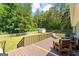 Enjoy outdoor living on this spacious deck with seating overlooking the backyard at 75 Mcintosh Estates Ct, Sharpsburg, GA 30277