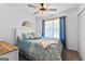 The main bedroom features a ceiling fan and a large window with curtains at 75 Mcintosh Estates Ct, Sharpsburg, GA 30277