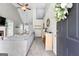 Open-concept layout with an entryway showcasing the living room, dining area, and stylish decor at 75 Mcintosh Estates Ct, Sharpsburg, GA 30277