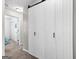 Hallway view of white sliding barn doors to an adjacent room at 75 Mcintosh Estates Ct, Sharpsburg, GA 30277