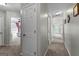 Neutral hallway featuring multiple doors and connections to other living spaces at 75 Mcintosh Estates Ct, Sharpsburg, GA 30277