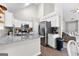 Modern kitchen featuring granite countertops, stainless steel appliances, and stylish white cabinetry at 75 Mcintosh Estates Ct, Sharpsburg, GA 30277
