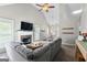 Spacious living area boasting a fireplace, vaulted ceilings, and a comfortable sectional sofa at 75 Mcintosh Estates Ct, Sharpsburg, GA 30277