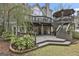 Multi-level deck and patio with stairs leading to the backyard and gazebo at 1000 Pleasance Grv, Peachtree City, GA 30269