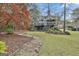 A sprawling backyard with landscaped details and a winding stone walkway at 1000 Pleasance Grv, Peachtree City, GA 30269