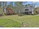 Lush backyard showing professional landscaping and mature trees at 1000 Pleasance Grv, Peachtree City, GA 30269