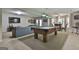 Spacious basement with pool table, large TV, and comfortable seating, ideal for recreation at 1000 Pleasance Grv, Peachtree City, GA 30269