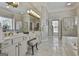 Luxurious bathroom featuring double sinks, a vanity area, and a separate shower and tub at 1000 Pleasance Grv, Peachtree City, GA 30269