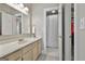 Bathroom featuring a double vanity, mirrored medicine cabinets, and shower with a curtain at 1000 Pleasance Grv, Peachtree City, GA 30269