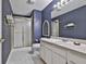 Bathroom with patterned wall paper, single vanity, a toilet, and shower with glass doors at 1000 Pleasance Grv, Peachtree City, GA 30269