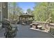Wooden deck with gazebo and outdoor seating, surrounded by lush trees at 1000 Pleasance Grv, Peachtree City, GA 30269