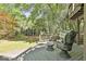 Back deck featuring comfortable outdoor seating and view of the treed backyard at 1000 Pleasance Grv, Peachtree City, GA 30269
