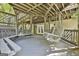 Large shaded deck with swing and bench seating is perfect for enjoying the outdoors at 1000 Pleasance Grv, Peachtree City, GA 30269