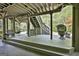 Covered deck with stairs leading to backyard, and outdoor seating at 1000 Pleasance Grv, Peachtree City, GA 30269