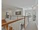Second story foyer with wood and white railing and plenty of natural light at 1000 Pleasance Grv, Peachtree City, GA 30269