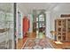 Entry foyer with hardwood floors, high ceilings, and an arched window at 1000 Pleasance Grv, Peachtree City, GA 30269