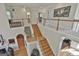 Spacious foyer with wooden stairs, railing, and views of living areas below at 1000 Pleasance Grv, Peachtree City, GA 30269