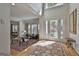 Bright foyer with hardwood floors, high ceilings and transom window in the background at 1000 Pleasance Grv, Peachtree City, GA 30269