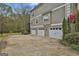 Attached three car garage with ample parking and a long driveway at 1000 Pleasance Grv, Peachtree City, GA 30269