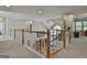 Open hallway with wooden banister and view of living area at 1000 Pleasance Grv, Peachtree City, GA 30269