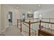 Upstairs hallway showcasing crown molding and decorative art at 1000 Pleasance Grv, Peachtree City, GA 30269