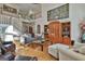 Large living room features two-story ceilings, hardwood floors, and elegant decor at 1000 Pleasance Grv, Peachtree City, GA 30269