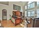 Bright living room with large arched windows and views of the outside at 1000 Pleasance Grv, Peachtree City, GA 30269