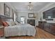 Main bedroom offering hardwood floors, fireplace, and access to the outdoors at 1000 Pleasance Grv, Peachtree City, GA 30269