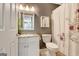 Neutral bathroom featuring vanity with storage, updated lighting, and shower/tub combo at 606 Ridgelake Dr, Peachtree City, GA 30269