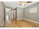 Bedroom offers fresh paint, hardwood floors, ceiling fan, access to bathroom and hallway at 606 Ridgelake Dr, Peachtree City, GA 30269