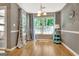 Bright dining room with hardwood floors, and large windows with a view of the outdoors at 606 Ridgelake Dr, Peachtree City, GA 30269