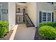 Exterior shot of condo building with staircase leading to upper units, surrounded by greenery at 606 Ridgelake Dr, Peachtree City, GA 30269