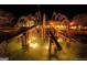 Night view of a decorative fountain with lighted water jets, enhancing the community's aesthetic appeal at 606 Ridgelake Dr, Peachtree City, GA 30269