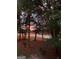 Beautiful view of the lake surrounded by trees and a colorful sky at 606 Ridgelake Dr, Peachtree City, GA 30269