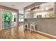Bright living room with hardwood floors, view of the kitchen and access to the balcony at 606 Ridgelake Dr, Peachtree City, GA 30269