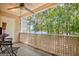 Charming patio with ceiling fan, string lights, and a beautiful lake view at 606 Ridgelake Dr, Peachtree City, GA 30269