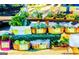 Colorful display of fresh vegetables at an outdoor produce stand, including kale, chard, and lettuce at 606 Ridgelake Dr, Peachtree City, GA 30269