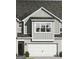 Charming home featuring a gray color scheme, attached two-car garage and nicely manicured landscaping at 2274 Santa Fe St # 20, Morrow, GA 30260