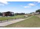 Outdoor amphitheater with a grassy lawn and stage for community events and performances at 823 Mackay Crk, Woodstock, GA 30188