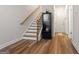A view of the entryway with a hardwood floor, a staircase, and a cabinet at 823 Mackay Crk, Woodstock, GA 30188