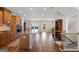A view of the kitchen and dining area with wood cabinets, granite countertops, and stainless steel appliances at 823 Mackay Crk, Woodstock, GA 30188