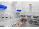 Organized pantry with wire shelving providing ample storage for kitchen essentials and appliances at 823 Mackay Crk, Woodstock, GA 30188