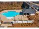 Aerial view of the community pool with a pool house and lounge area at 823 Mackay Crk, Woodstock, GA 30188