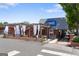Exterior of a restaurant with outdoor patio seating and a modern sign at 823 Mackay Crk, Woodstock, GA 30188